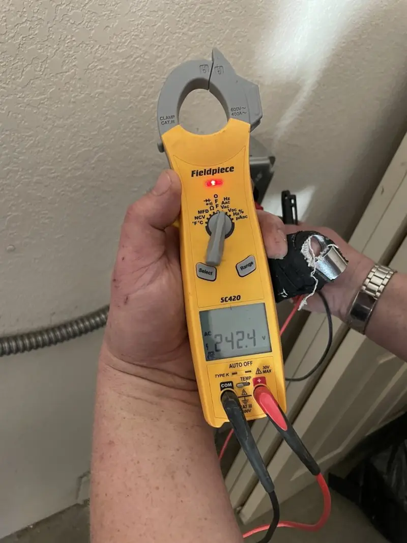 Voltage testing with clamp meter during Aluminum Wiring Replacement in Oxford